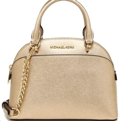 do real michael kors purses have mk logo in gold|Michael Kors gold purse large.